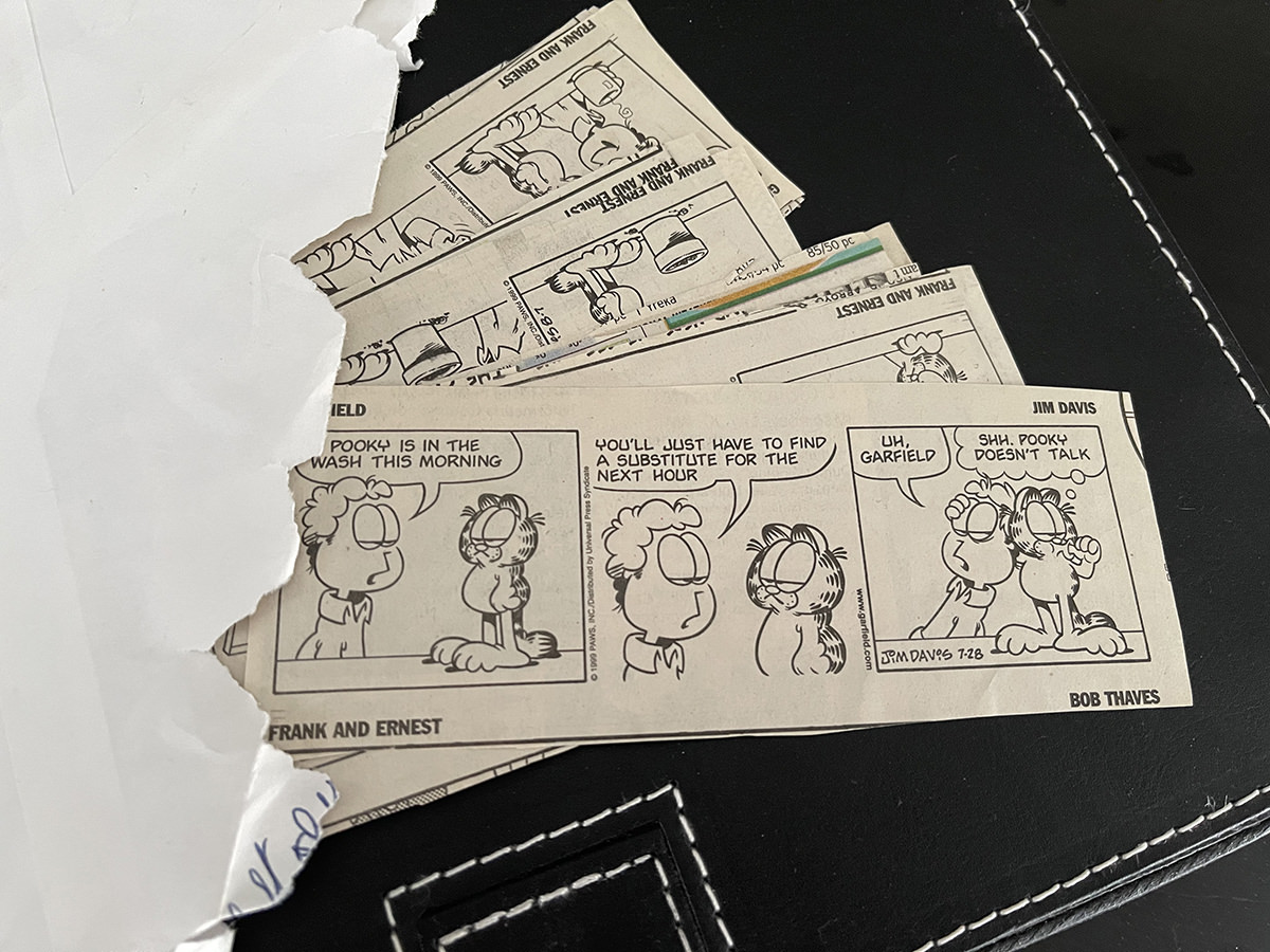 Garfield strips coming out of an envelope.