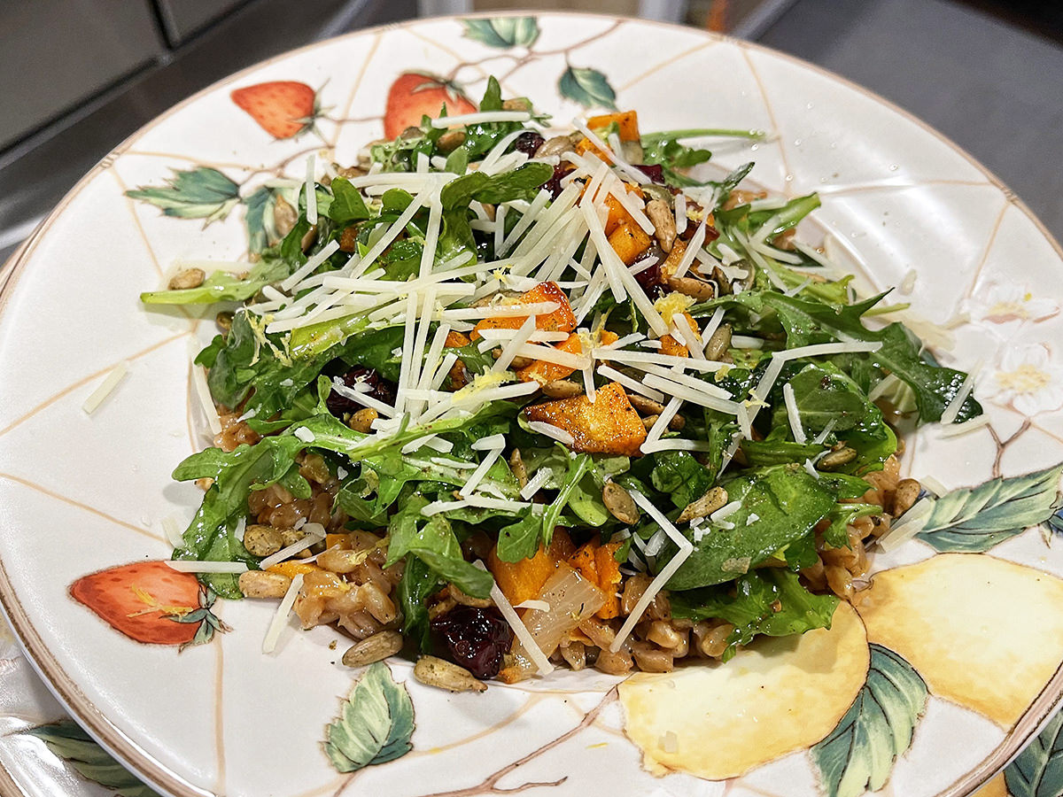 The creamy farro stuff under the winter vegetables looking all cheesy and delicious.