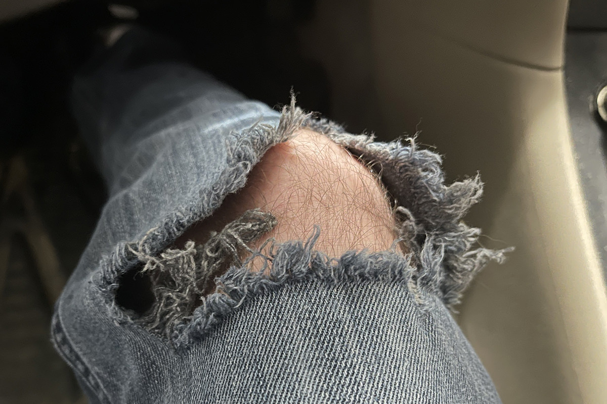 My knee ripped clean through my jeans while I'm sitting in my car.