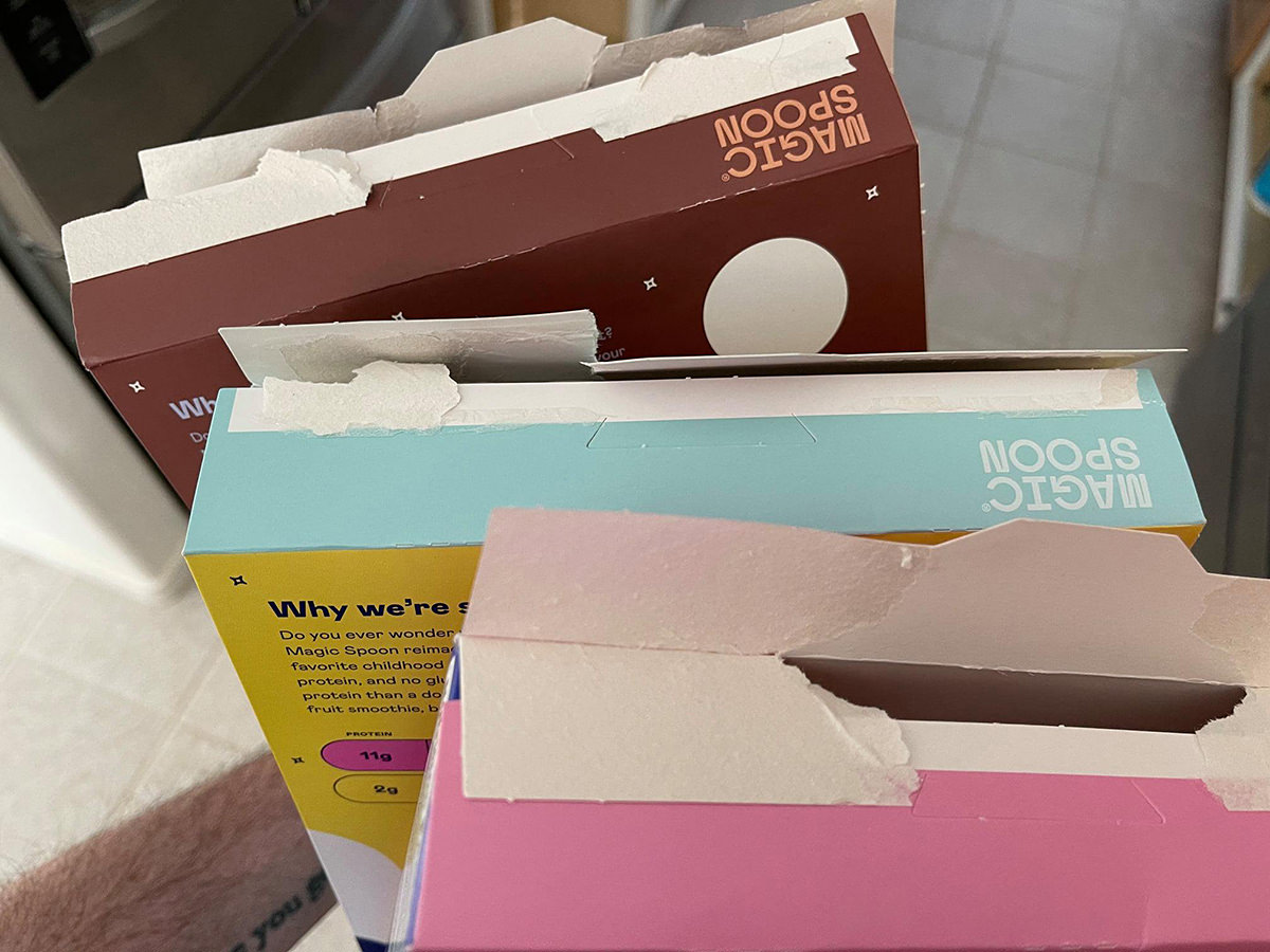 Boxes of Magic Spoon cereal which have been ripped to shit trying to get them open.