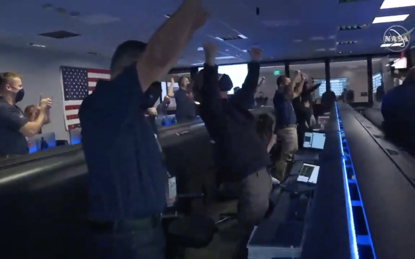 NASA engineers celebrating the successful landing.