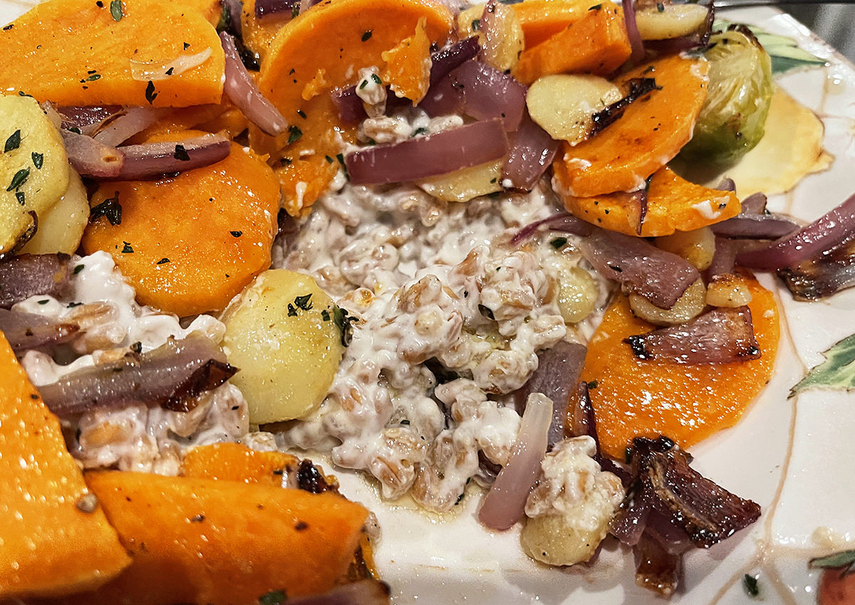 The creamy farro stuff under the winter vegetables looking all cheesy and delicious.