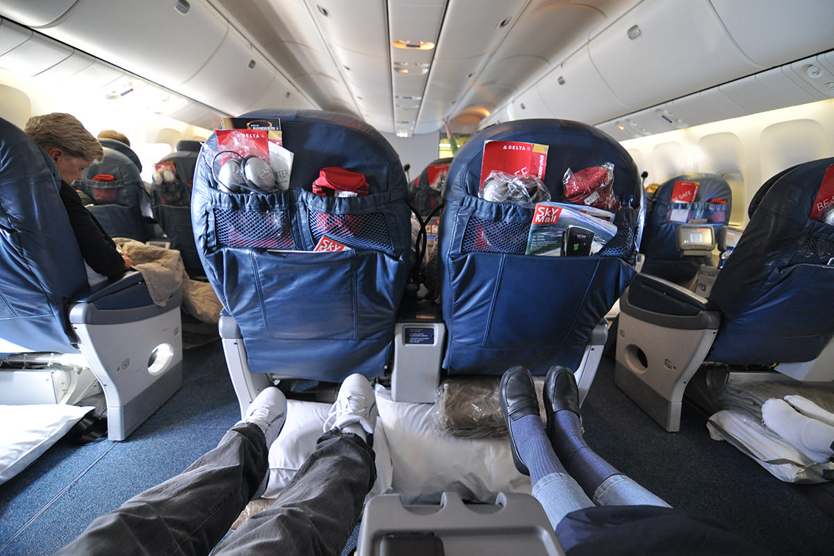 Mom and my feet stretched out enjoying World Business Class luxury.