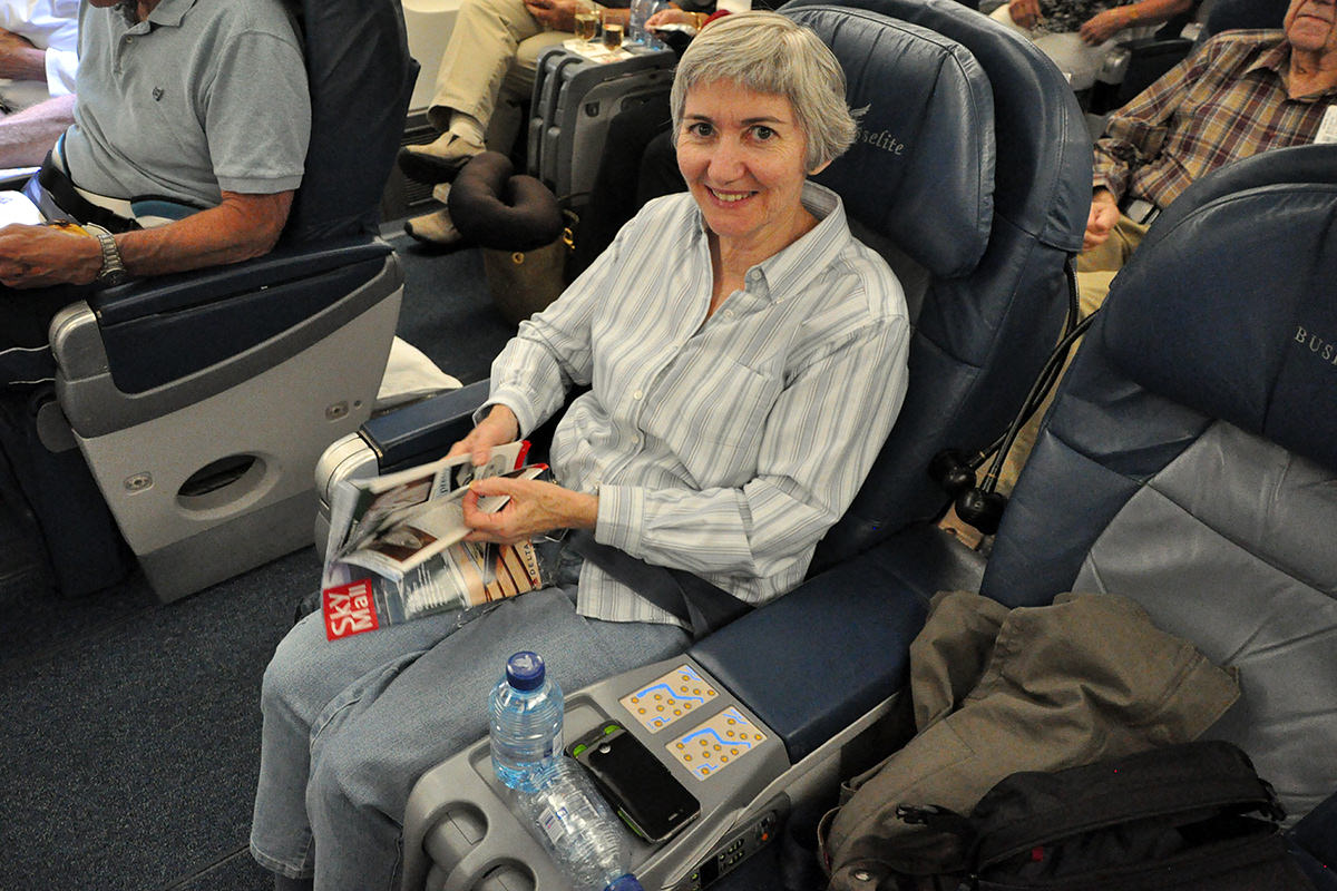 Mom and my feet stretched out enjoying World Business Class luxury.