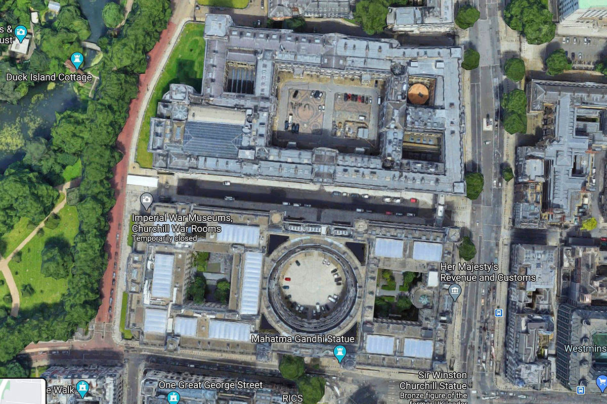 An aerial view of a parking rotunda in the middle of a building.