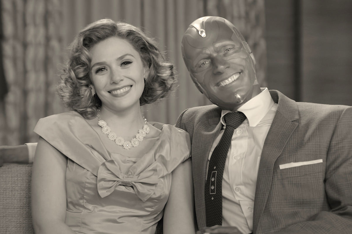 Vision and Wanda in black-and-white sitting in a 50's sitcom.