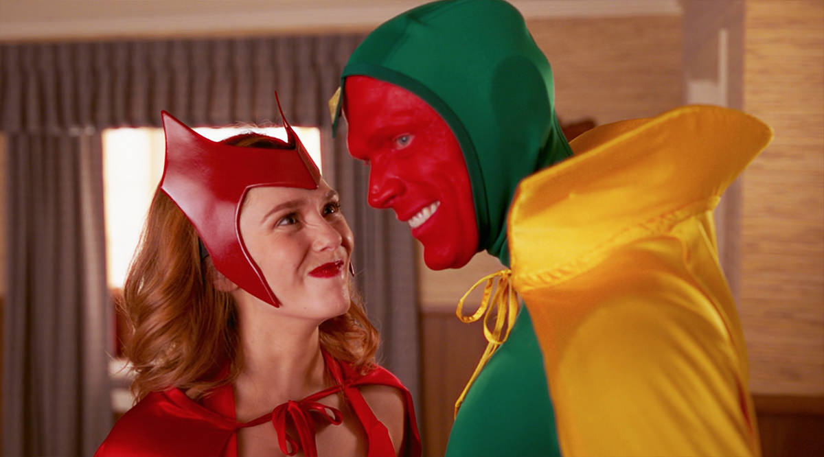 Wanda and Vision wearing their comic book costumes for Scarlet Witch and Vision as Halloween costumes.