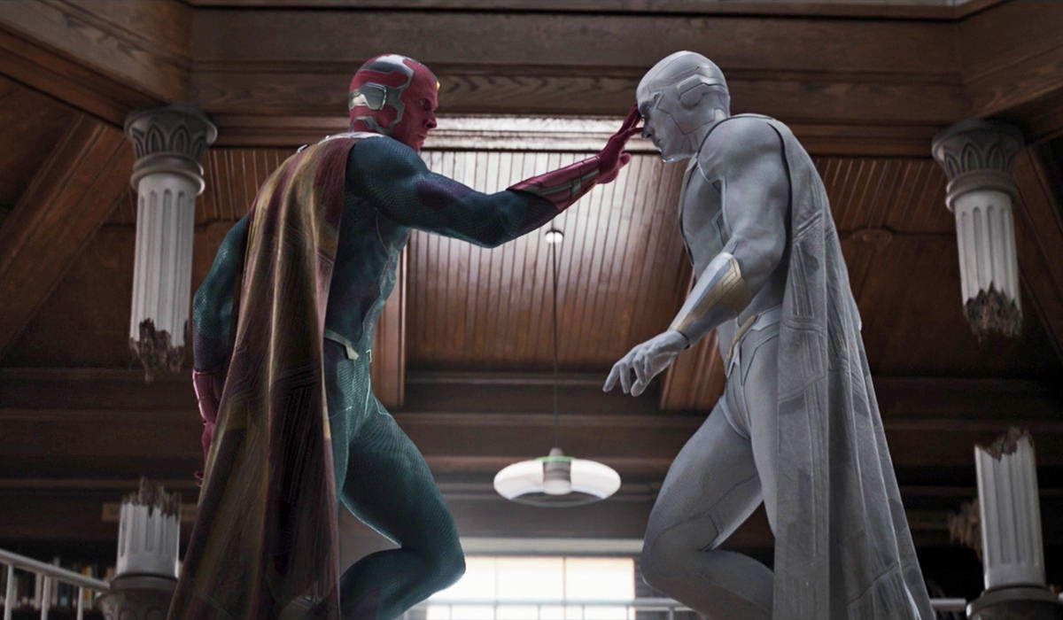 Wanda's recreated Vision touching the forehead of the corpse of Vision.