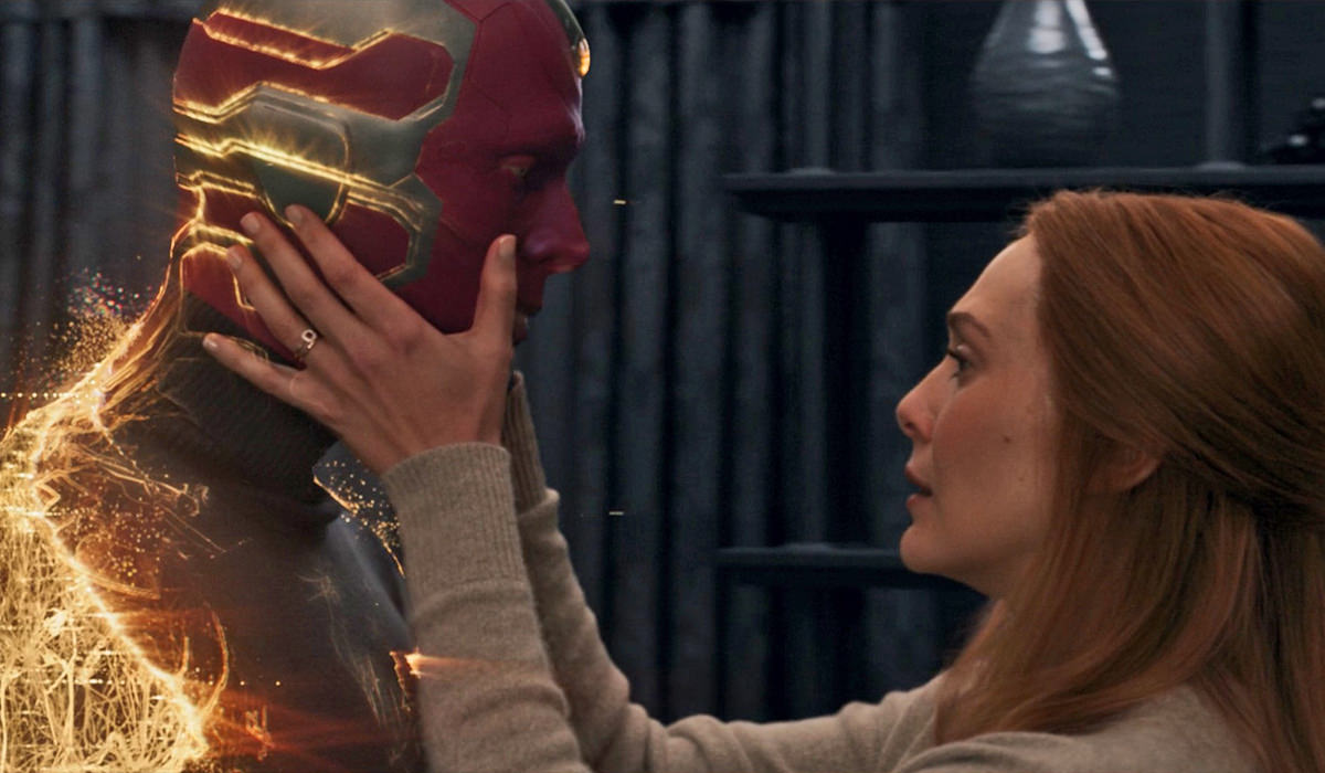 The Vision disappearing as Wanda holds him.