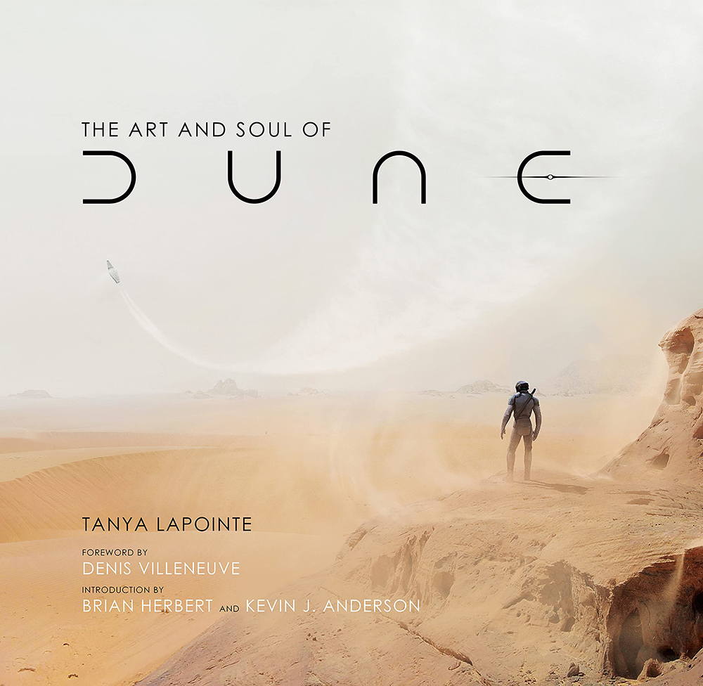 The cover for The Art and Soul of Dune showing Paul looking out into the desert as a ship flies overhead.