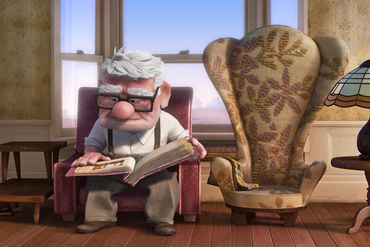 A still from the movie UP by Disney/Pixar showing an older Carl Fredrickson missing his wife.