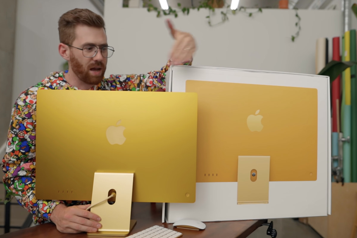 Comparing the gold iMac to the yellow iMac on the box.