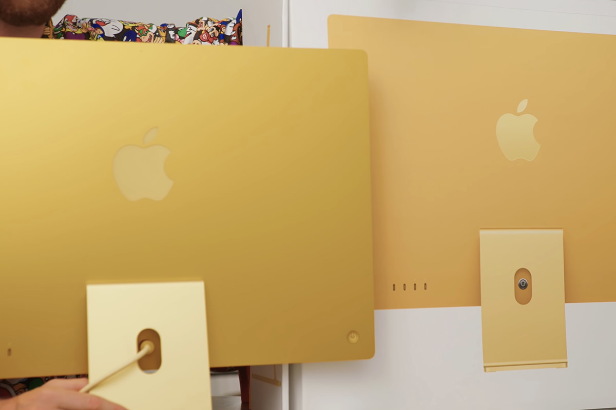 Comparing the gold iMac to the yellow iMac on the box.