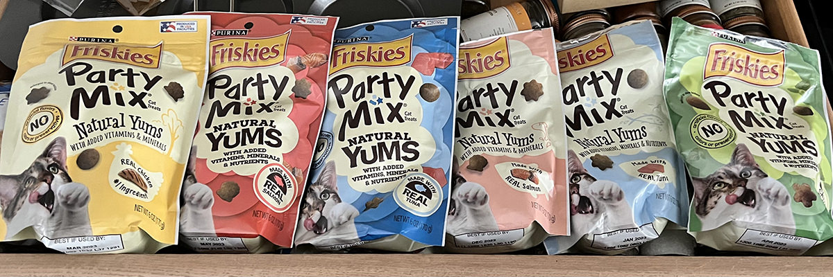 Bags of verious Party Mix Cat Treat flavors.