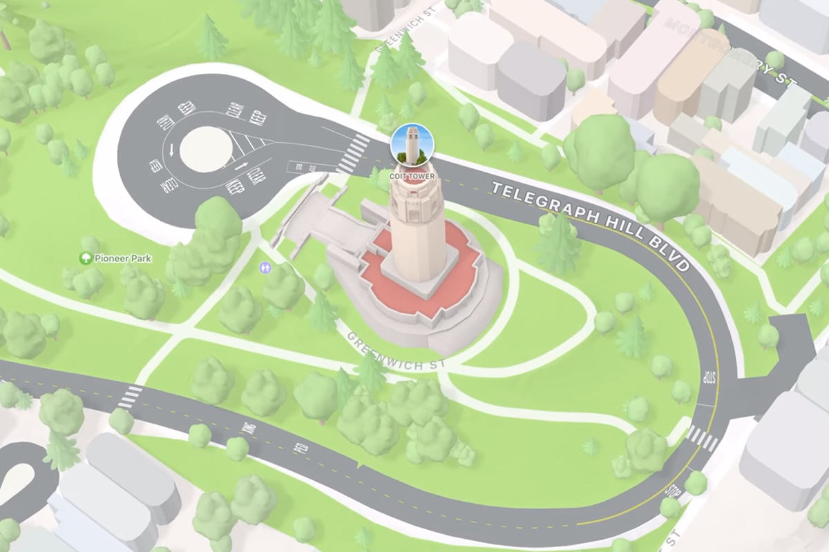 Apple Maps showing a beautifully-rendered 3D map of San Francisco that's zoomed in to Coit Tower, with a landmark badge for Intelligence.