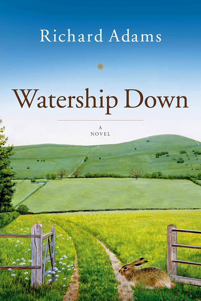 The cover of Watership Down, a novel, showing a bunny in front of a fence that borders a green, grassy field.