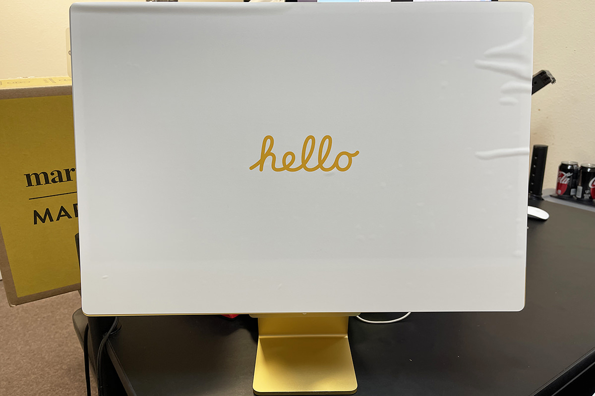 The Macintosh G4 Cube computer next to a matching monitor and keyboard.