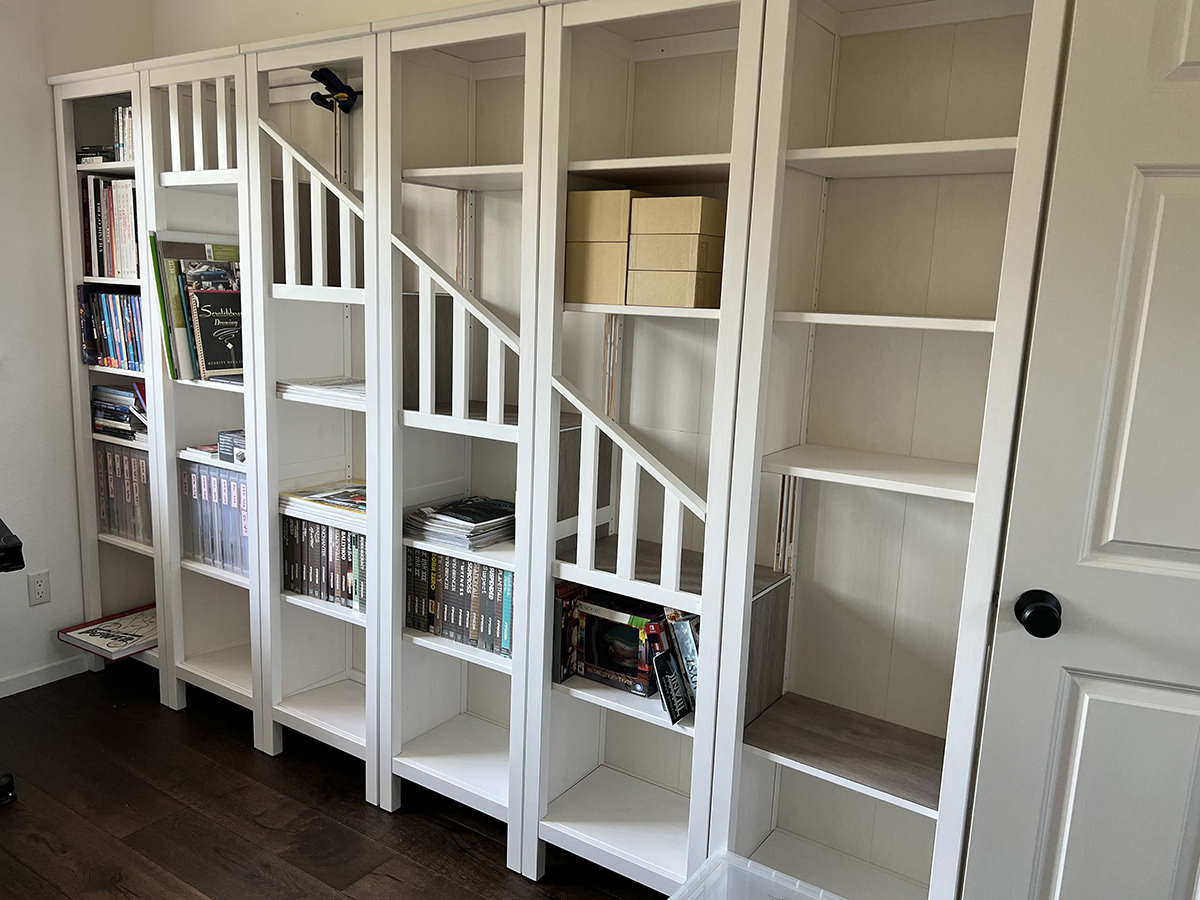 A staircase in the bookcase.