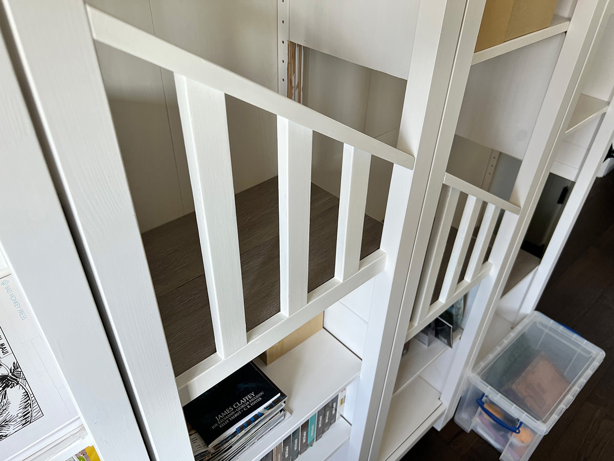 A staircase in the bookcase.