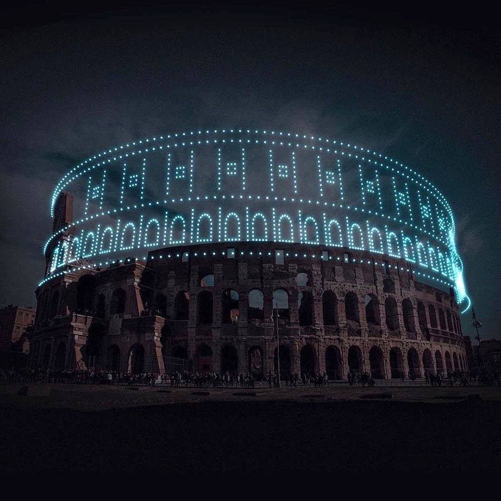 The Roman Colosseum ruins completed by drone lights.