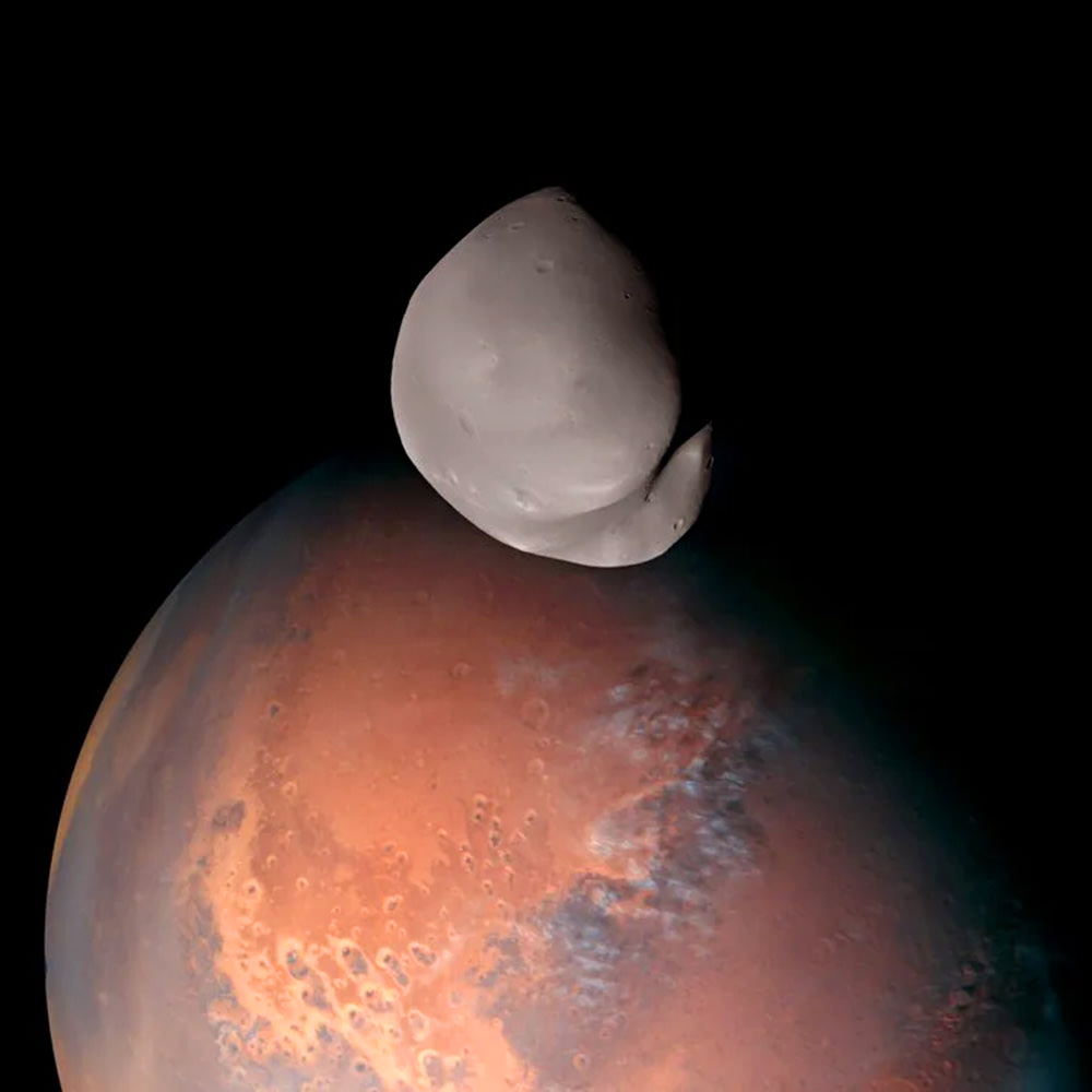 Deimos floating above Mars!