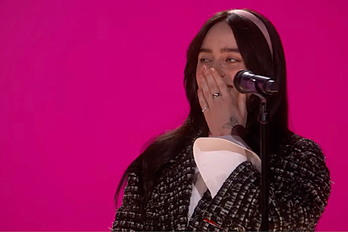 Billie Eilish looking shocked after getting a standing ovation.