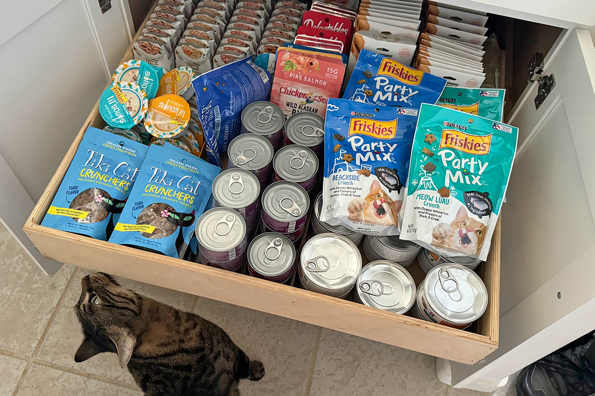 The cat food drawer full to the brim.