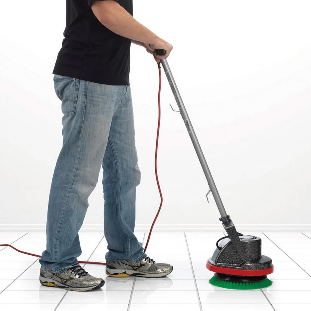 Random guy scrubbing with the Oreck floor scrubber.