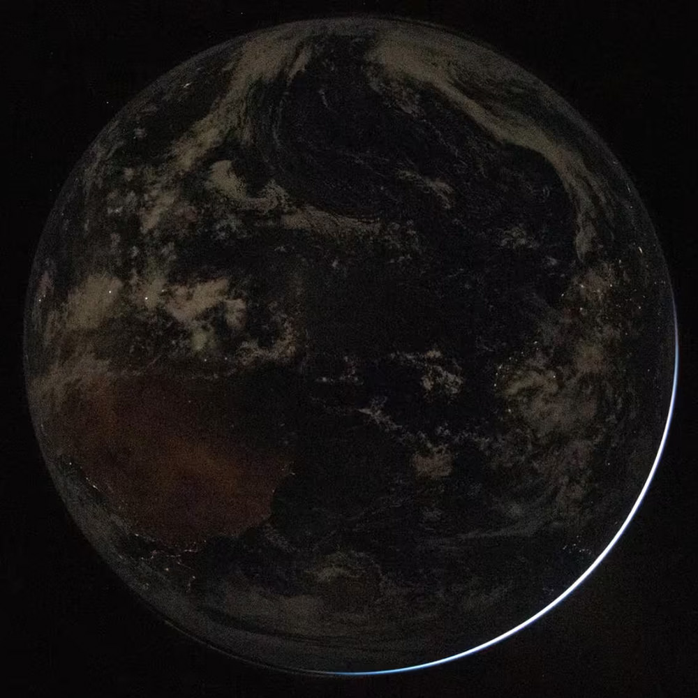 The earth in darkness! And it's a globe!