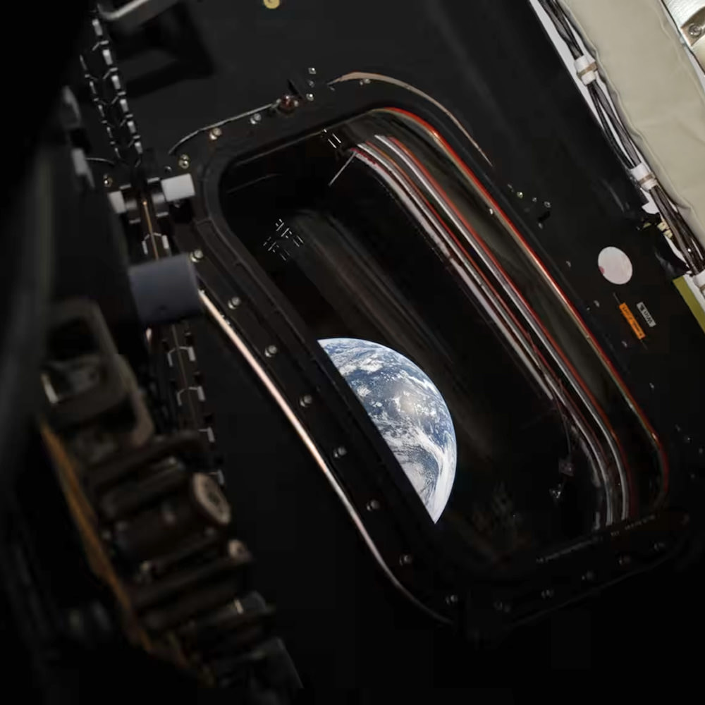 Earth out the window of the space capsule! And it's a globe!