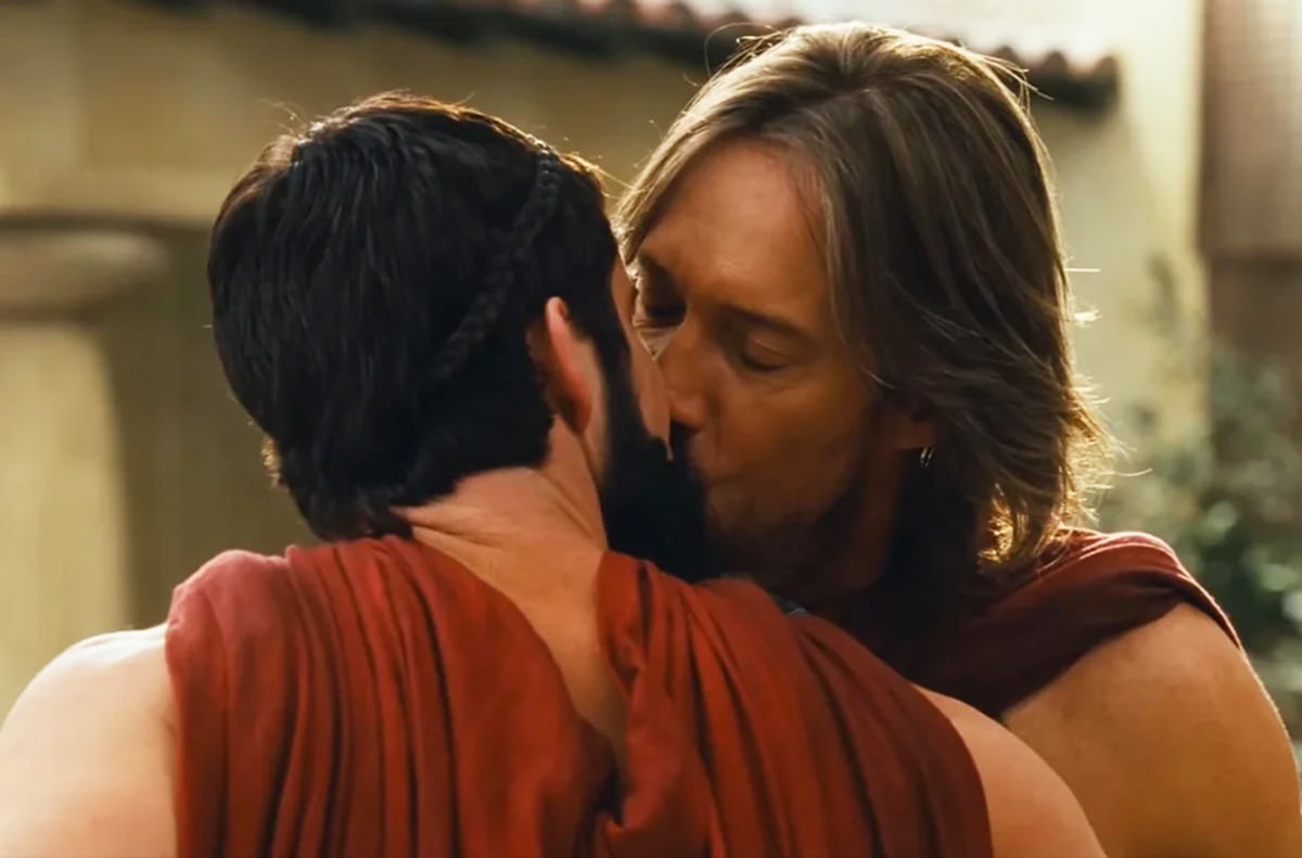 Kevin Sorbo kissing a dude.