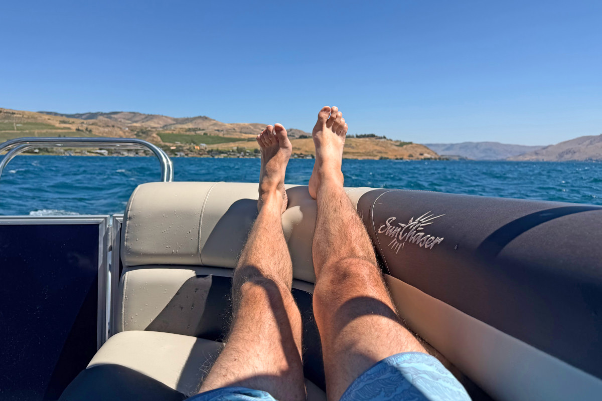 My legs are up on the side of the boat.