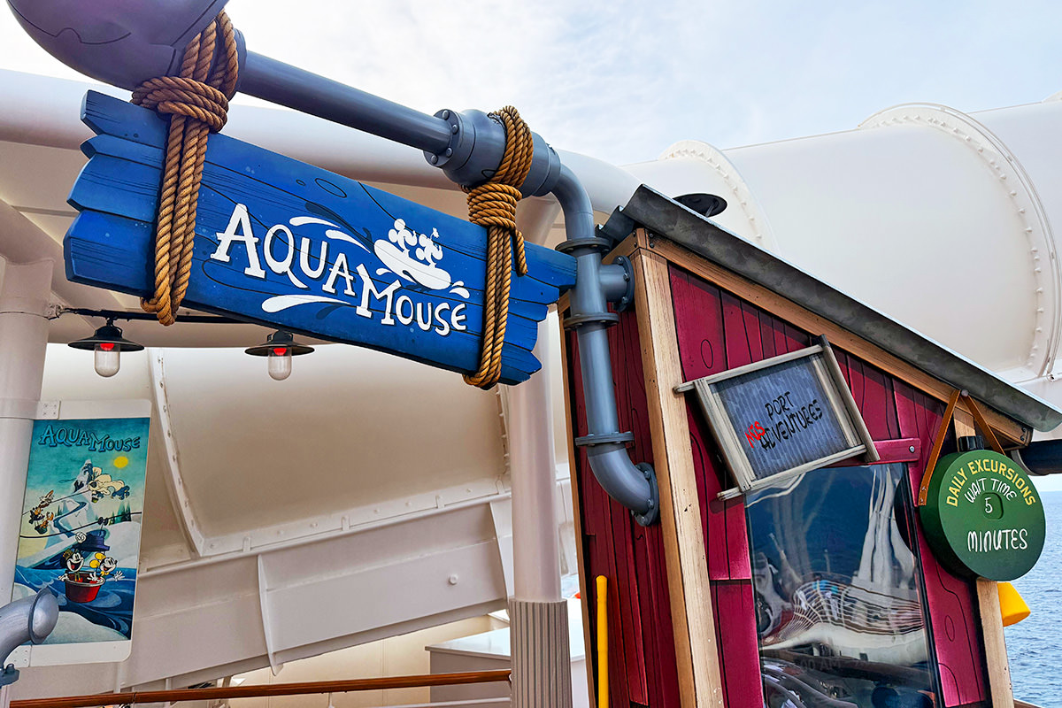 A sign for the AquaMouse waterslide on the Disney Wish