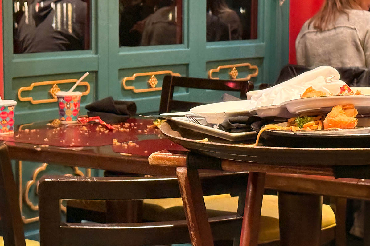 Disaster table covered with food everywhere.