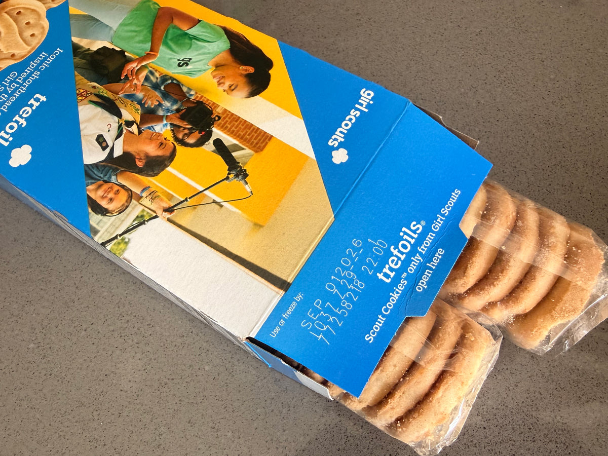 Two packs of cookies coming out of a box.