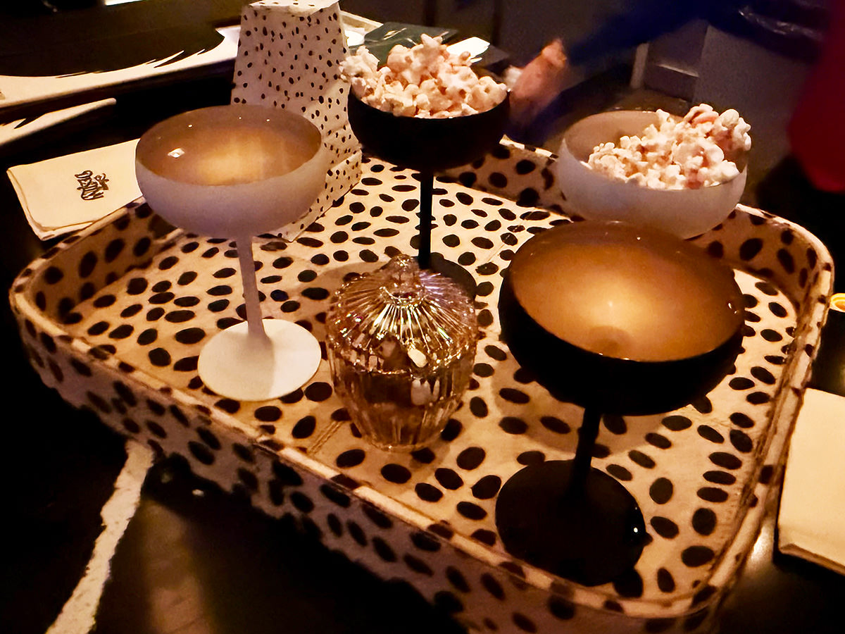 Tray of drinks in black and white at deVil's on the Disney Destiny