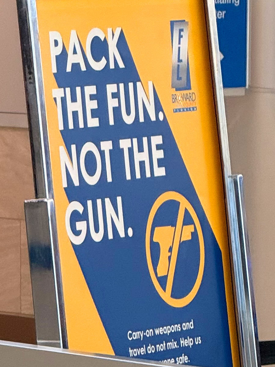 Sign at the airport saying PACK THE FUN NOT THE GUN.