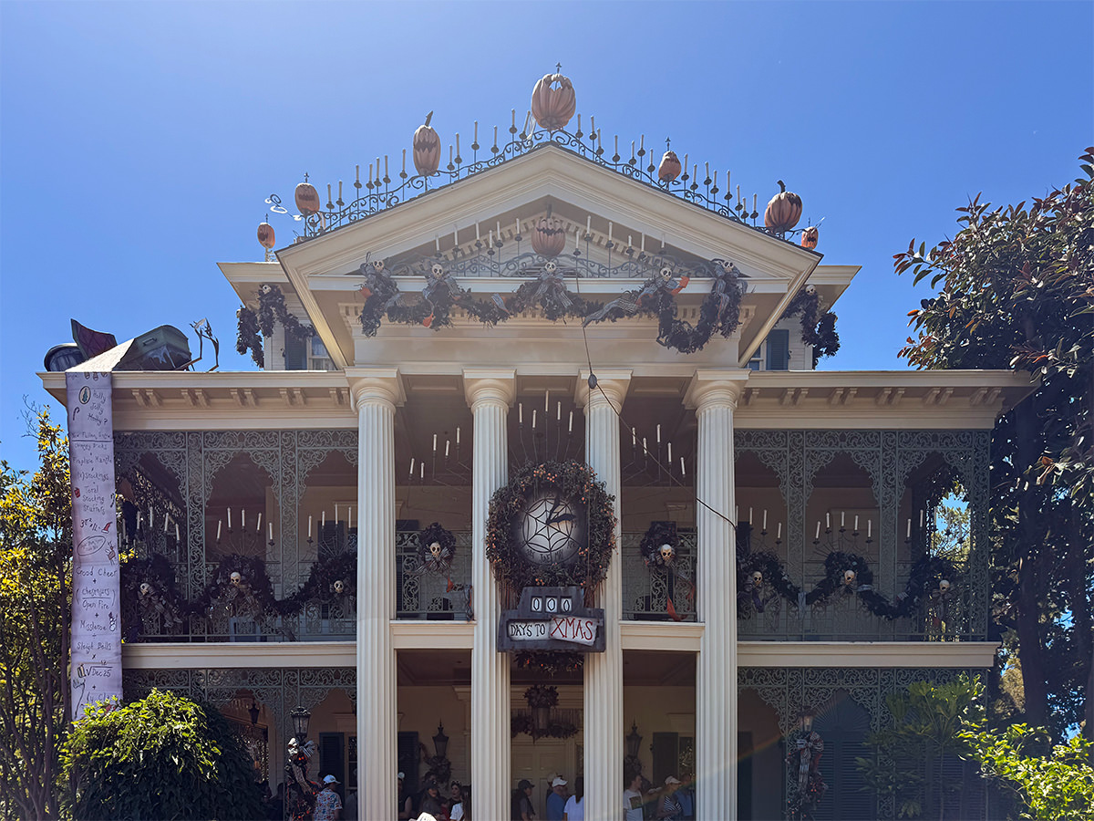 The Haunted Mansion dressed for Halloween and Christmas.