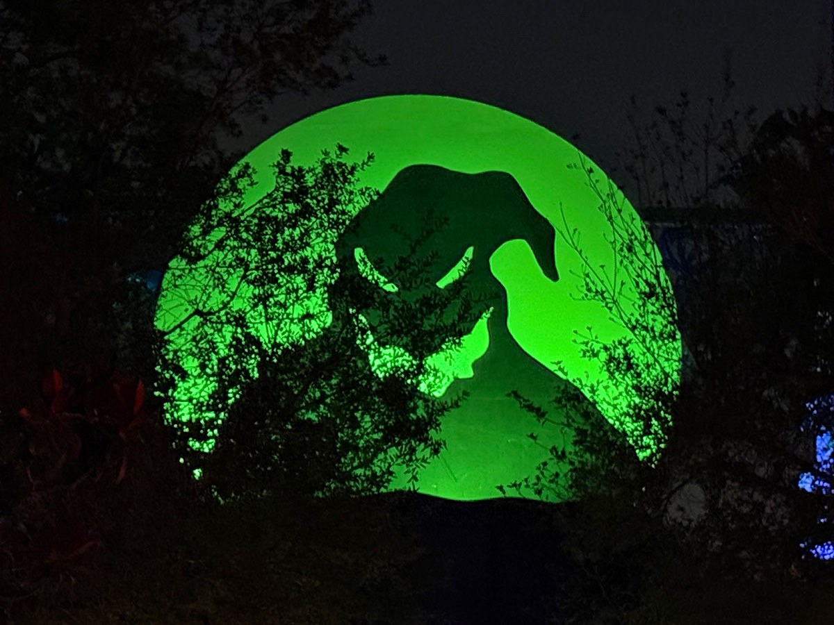 Oogie Boogie sign glowing green.